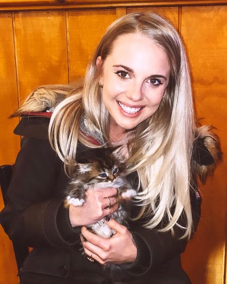 Nicole Franzel poses a picture with her cat.